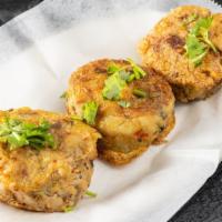 Aloo Tikka (3 Pieces) · A golden fried-potato patty that is stuffed with peas and dal.