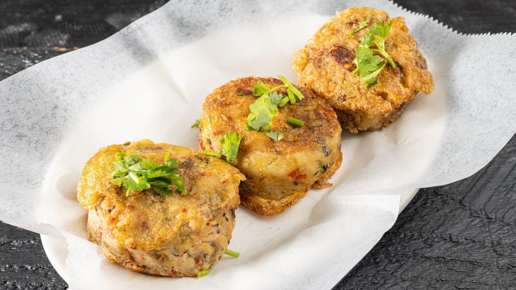Aloo Tikka (3 Pieces) · A golden fried-potato patty that is stuffed with peas and dal.