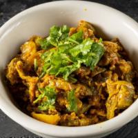Aloo Bengan · Eggplant and potatoes cooked in curry.