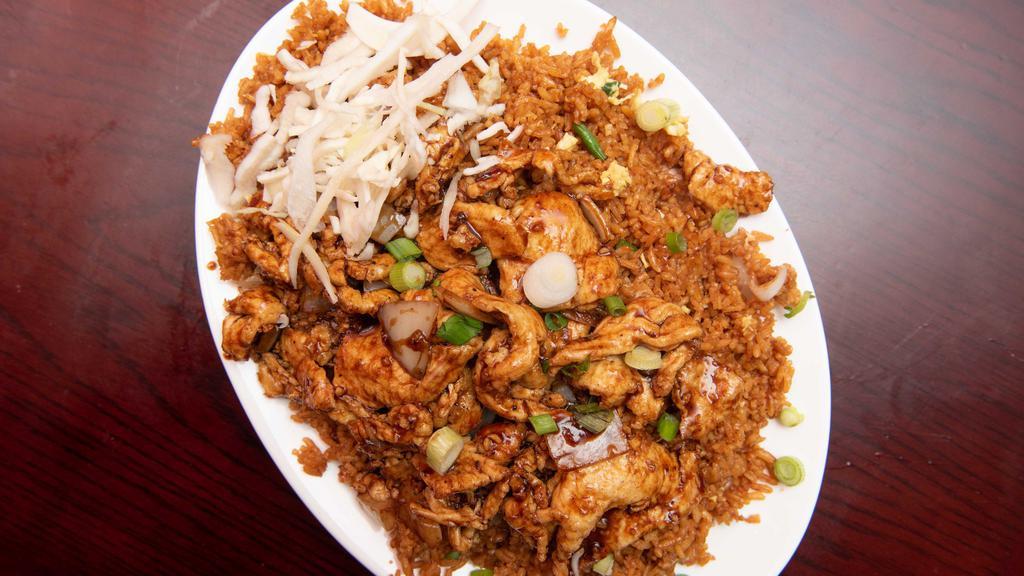 Spicy Chicken Fried Rice · Boneless chicken in spicy sauce on top of fried rice
