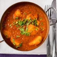 Chicken Vindaloo · Goan style chicken cooked with potatoes in a spicy sauce.