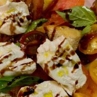 Heirloom Burrata · Heirloom tomato, basil, roasted crouton, balsamic reduction, olive oil.
