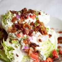 Little Gem Salad · Little gem lettuce wedge, bacon, tomato, red onion, crouton, blue cheese dressing.
