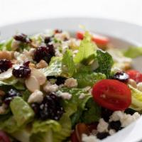 Cranberry & Feta Salad · Romaine hearts, sweet dried cranberries, chickpeas, toasted almonds, tomato, feta cheese, re...
