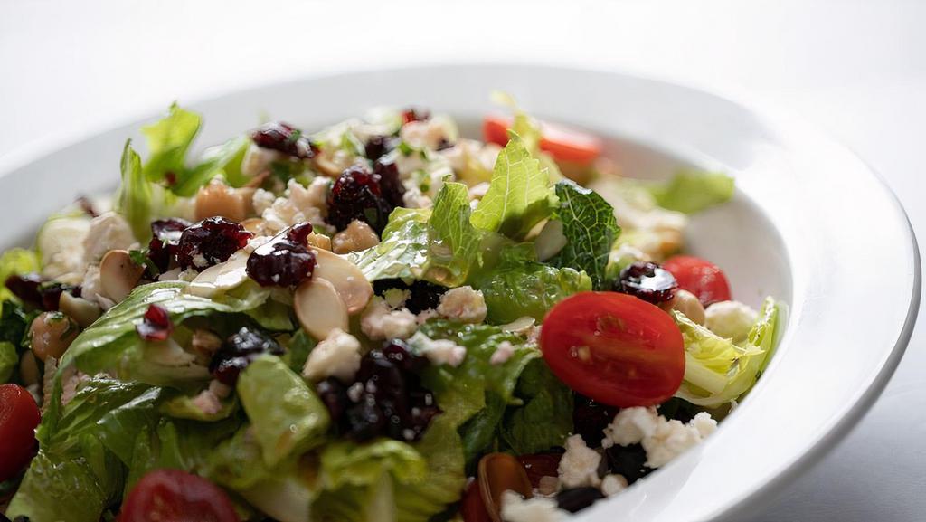 Cranberry & Feta Salad · Romaine hearts, sweet dried cranberries, chickpeas, toasted almonds, tomato, feta cheese, red wine vinaigrette.
