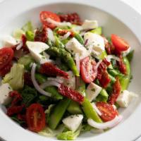 Arugula Salad · Baby arugula, radicchio, tomato, red onion, reggiano, lemon balsamic.