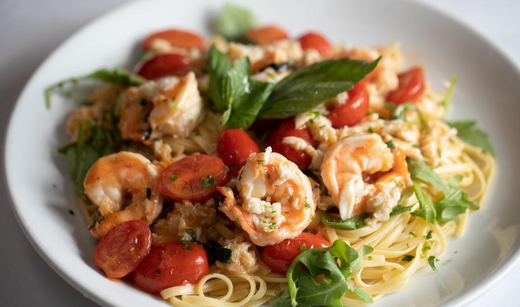 Linguini Di Maria · Jumbo shrimp, crab meat, arugula, white wine tomato basil sauce.