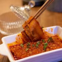 Pork In Garlic Sauce · Mild spicy. Thin sliced pork belly and served with garlic sauce.