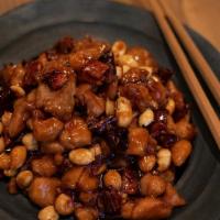 Kung Po Chicken · Medium spicy. Stir fried with peanuts & red peppercorn.