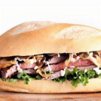 I.P. Steak Sandwich · Tender Steak Slices in Teriyaki or Bourbon BBQ Sauce, Lettuce, Sauteed Onions, Mushrooms & G...