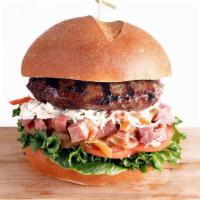 Pastrami Burger · Juicy 8 Oz Burger, Served on a Brioche Roll. Sautéed  Onions & Pastrami, Lettuce, Tomato, Co...