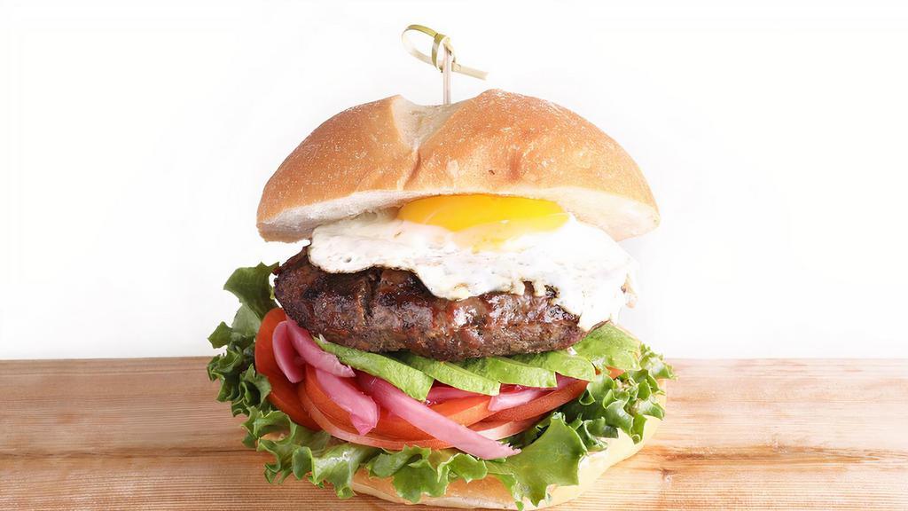 Sunshine Burger · Juicy 8 Oz Burger, Served on a Brioche Roll. Sunny Side up Egg, Lettuce, Tomato, Avocado, Pickled Red Onions, & Ranch Dressing.