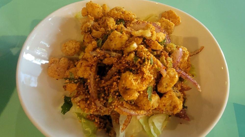 Zabb Popcorn Chicken · Fried chicken with thai seasoning topped with scallion, cilantro,red onion over lettuce. Spicy.