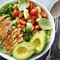 Grilled Chicken Salad · Fresh salad with mixed greens, boiled eggs, tomato, and toasted almonds topped with balsamic...