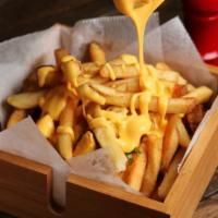 Cheese Fries · Crispy, golden brown french fries topped with melted cheddar and jack cheese.