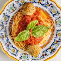 Spaghetti Meatballs · Spaghetti and handmade meatballs topped with tomato sauce.