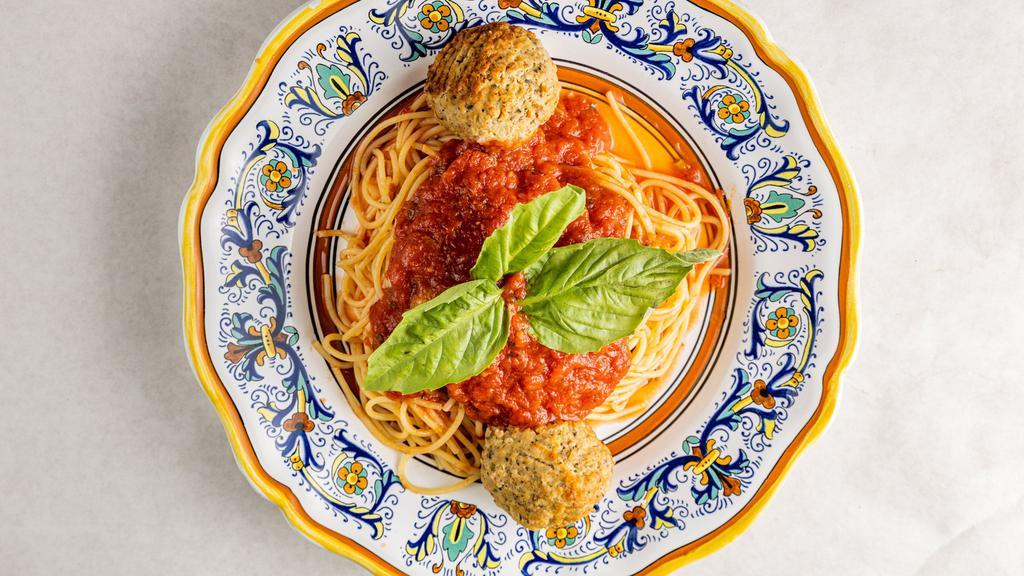 Spaghetti Meatballs · Spaghetti and handmade meatballs topped with tomato sauce.
