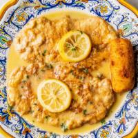 Salmone Livornese · Salmon with onions, capers, and green olives in marsala wine sauce.