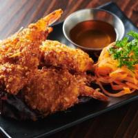 Coconut Shrimp · Crispy whole shrimp marinated with house special recipe and shredded coconut served with plu...
