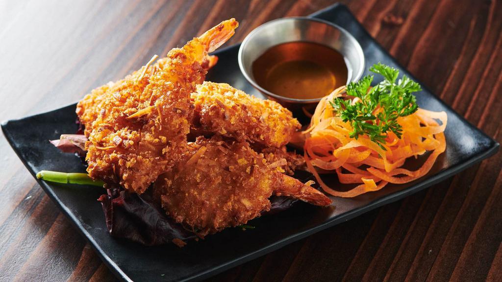 Coconut Shrimp · Crispy whole shrimp marinated with house special recipe and shredded coconut served with plum sauce.