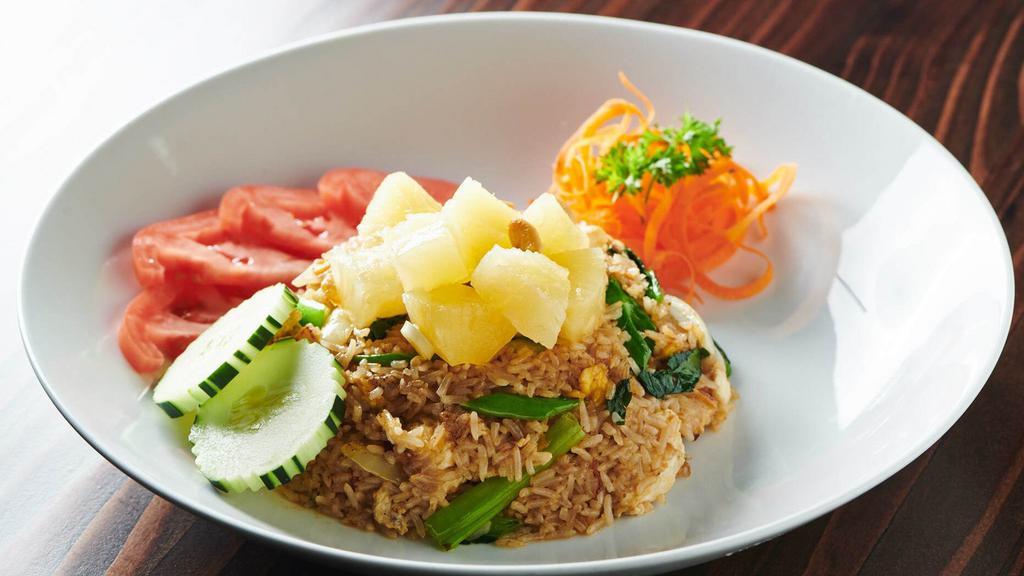 Pineapple Fried Rice · Egg, Onion, Carrot, Scallion, Cashew nut, Pineapple and Tomato.