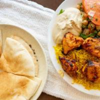 Chicken Shish Kebab · Marinated cubes of chicken breast. Served with rice, cracked wheat, salad, and 2 pitas.