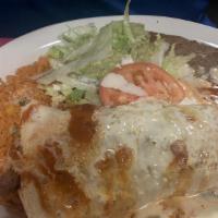 Mucho Grande Burrito · One big burrito filled with your choice of fried chicken or steak, cooked with onions, bell ...