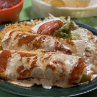 Burritos Mexicanos · Two burritos filled with grilled chicken or steak. sautéed onions. tomatoes, bell peppers, b...