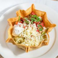 Taco Salad · Crispy flour shell with choice of ground beef or chicken, beans, lettuce, tomatoes, cheese, ...