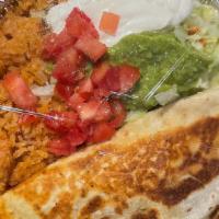 Quesadilla Verde · Stuffed cheese quesadilla with your choice of ground beef or chicken or beans, topped with g...