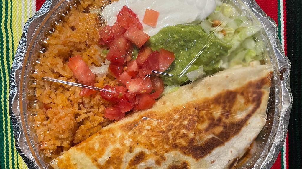 Quesadilla Verde · Stuffed cheese quesadilla with your choice of ground beef or chicken or beans, topped with green sauce and cheese sauce, served with guacamole salad, rice and beans.