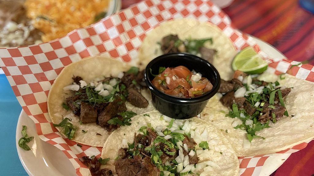 Tacos De Lengua · Three four tortillas or four corn tortillas with grilled chicken, served with rice beans, Pico de Gallo, tomato save and time
