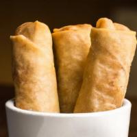 Crispy Spring Rolls · Carrot, basil, cabbage, and vermicelli with lime mustard seed sauce .
