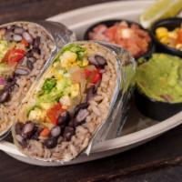 Vegetarian Burrito · Homemade corn salad, traditional guacamole, roasted peppers, and onions. Served with shredde...