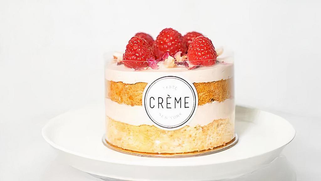 Lychee Raspberry Rose · Delicate chiffon cake with layers of rose petal whipped cream topped with refreshing lychee and sweet raspberries