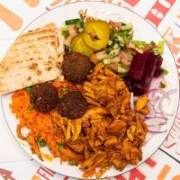Chicken Shawafel Medium Bowl · Thinly sliced, flame roasted chicken and falafel balls. Served with rice, salad (lettuce, pi...