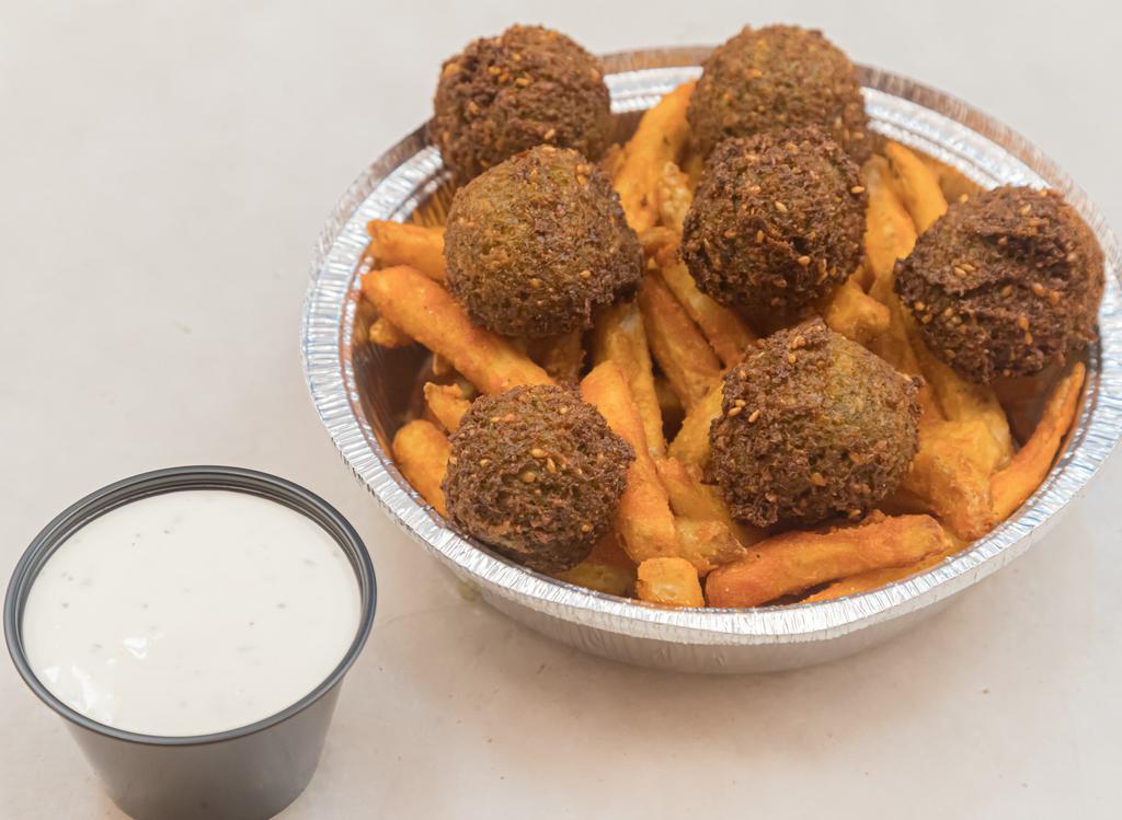 Falafel Fries · Extra crispy seasoned fries with falafel balls. Comes with a side of white sauce.