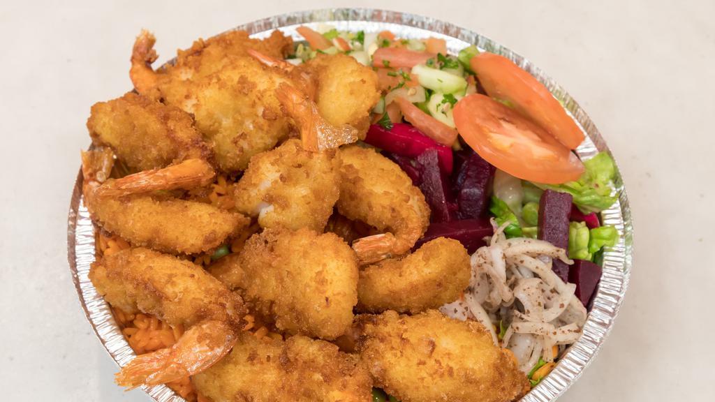Fried Shrimp Over Rice And Salad · Breaded panko shrimp served over rice and salad.