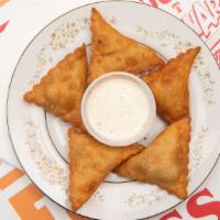 Indian Samosas · 5 pieces of Indian style pastry stuffed with spiced potatoes. Medium spicy.

Allergen Note: ...