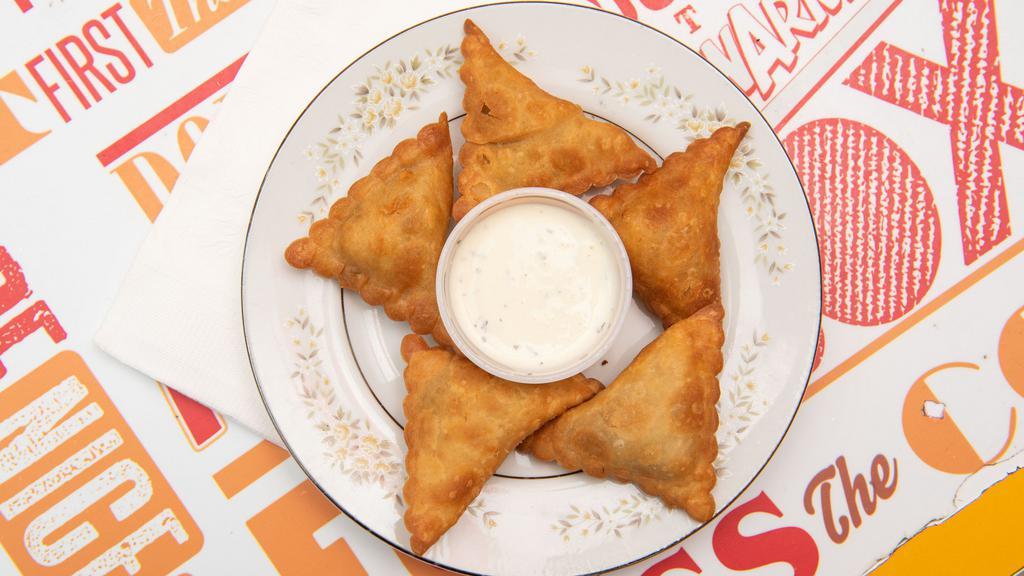 Vegetable Samosas · 5 pieces of pastry stuffed with spiced potatoes, green peas and carrots. Medium spicy.

Allergen Note: Contains wheat gluten