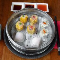 Dim Sum Sampler (蝦餃, 燒賣, 雞燒賣, 蝦燒賣) · A selection of our finest handcrafted dim sum steamed dumplings