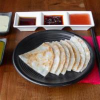 Roti (咖哩印度麵包) · Vegetarian. Indian flatbread (two) with haus dipping sauce.