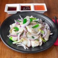 Sautéed Flounder Fillets With Ginger & Scallions (羌蔥魚片) · Flounder fillets sautéed with julienned ginger and scallions.