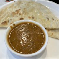 Dal Makhni · The harmonious blend of black lentil, red kidney beans tomatoes, ginger finished with cream ...