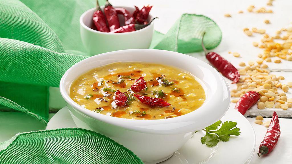 Dal Tadka · Comfort food boiled yellow lentil spiced up with Indian herbs. Come with Rice