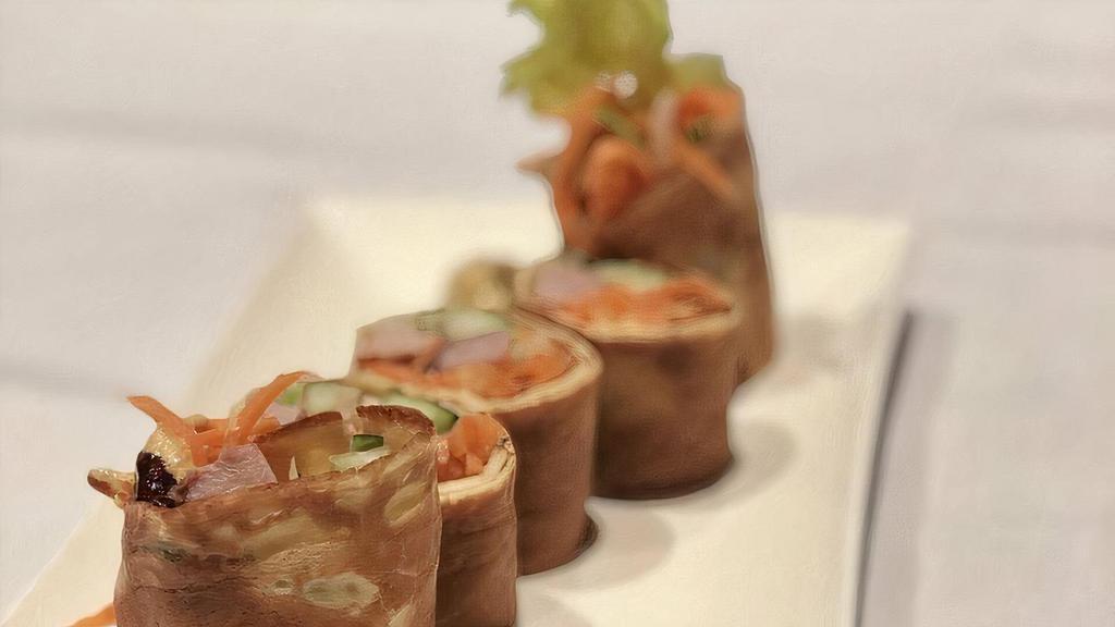 Duck Roll · Roast duck, scallion, cucumber, carrot and ginger wrapped in a thin fresh crepe. French mustard and hoisin sauce.