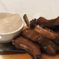 Tri Flavor Baby Back Ribs · Tender pork ribs marinated in tri-flavor sauce and sticky rice.