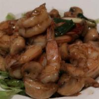 Koong Gra Tiem · Sautéed jumbo shrimp, mushroom and garlic peppercorn sauce, served with jasmine rice.