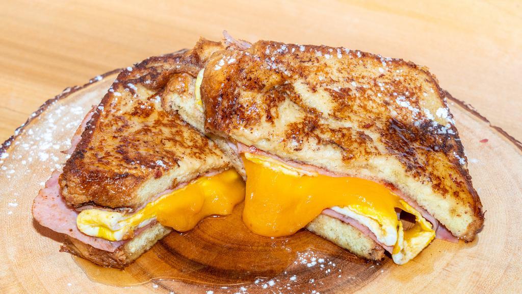 Freaking French Toast · Forest ham, fried eggs, Vermont Cheddar cheese, maple syrup.