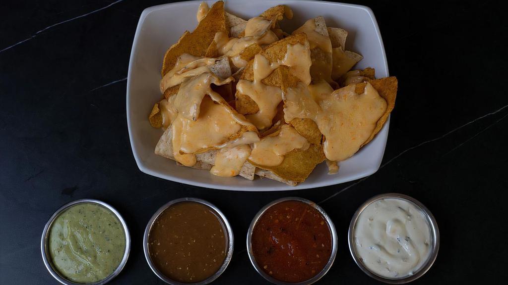 Nacho Chips With Molten Cheese & Salsa Dip · 